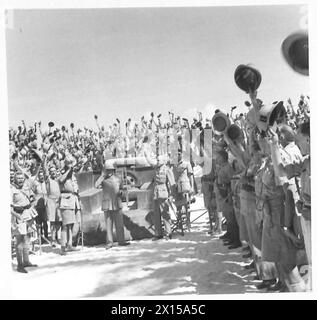 FIELD MARSHAL SMUTS VISITS THE SOUTH AFRICAN TROOPS IN THE WESTERN DESERT - The troops cheering, after listening to the Field Marshal's speech British Army Stock Photo