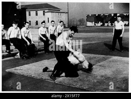British Army troops undergo toughening exercises at a weapon training ...