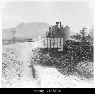 ITALY : CLEARING A ROAD THROUGH CASSINO - Bulldozer at work on the railway track near town British Army Stock Photo