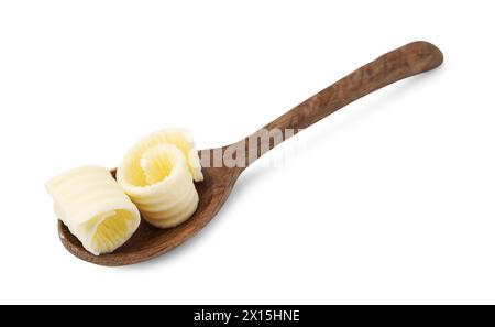 Tasty butter curls in spoon isolated on white Stock Photo