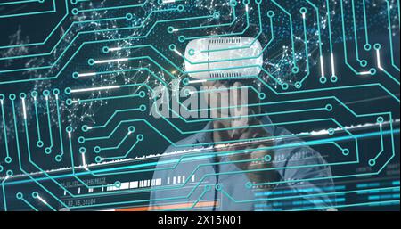 Image of data processing and globe over screens Stock Photo