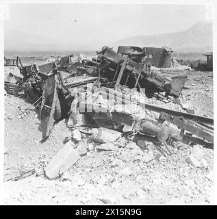 ITALY : CLEARING A ROAD THROUGH CASSINO - The remains of a railway truck which had been carrying German vehicles British Army Stock Photo