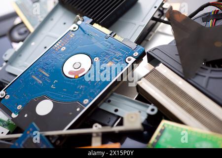 Close up of stacked components of an old laptop on a table. Stock Photo