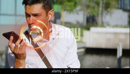 Image of spinning round scanner over biracial man talking on smartphone outdoors Stock Photo