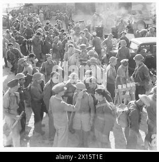 BRITISH TROOPS ARRIVE IN EGYPT FROM CRETE - A scene on the quayside when troops received tes and cigarettes on landing British Army Stock Photo