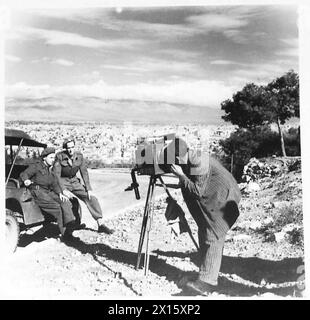 GREECE : ANCIENT & MODERN - Sgt. Gregory and Dvr. Hardman have their photograph taken in the Acropolis. Below them, in the background, is the city of Athens British Army Stock Photo