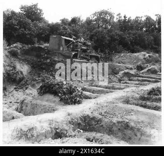 VIENNA TODAY - A bulldozer driven by a British R.E.filling in the massed graves of those who died during the siege of Vienna British Army Stock Photo