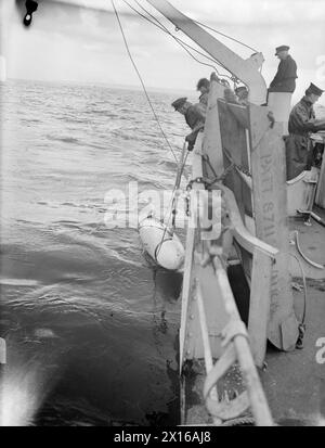 MINESWEEPERS HARD AT WORK TO MAKE SEAS SAFE AGAIN. JULY 1945, ON BOARD ...