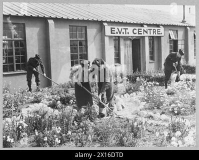 'CIVVY STREET COURSE' IN R.A.F. PATHFINDER GROUP - 16004 Picture issued 1945 shows -Landscape and floral gardening are subjects given in the E.V.T. Classes at Downham Market, R.A.F. Station. Leading Aircraftman Arthur Pickersgill [centre] of Dewsbury Road, Ossett, Yorks, who belongs to the R.A.F. and is now the station instructor Royal Air Force Stock Photo