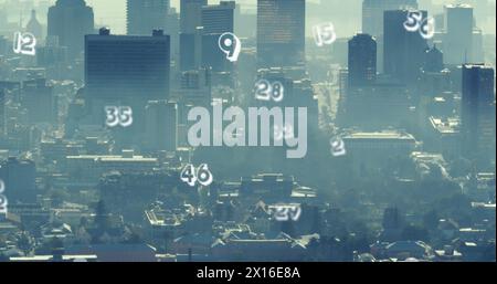 Image of numbers and data processing over cityscape Stock Photo