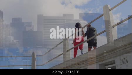 Image of infographic, buildings, african american woman with prosthetic leg walking with man Stock Photo