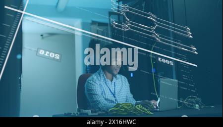 Image of data processing over african american male it technician working by computer servers Stock Photo