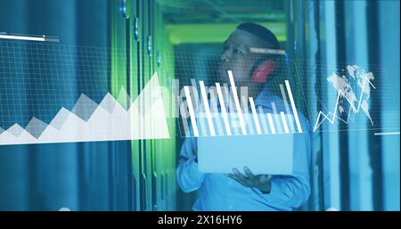 Image of data processing over african american male it technician working by computer servers Stock Photo