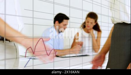 Image of digital interface and financial data processing over caucasian businesspeople Stock Photo