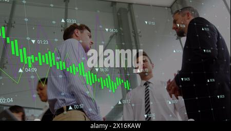 Image of digital interface and financial data processing over business people Stock Photo