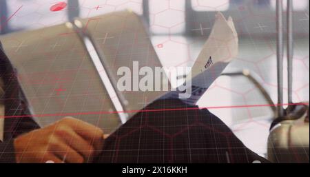 Image of data processing over caucasian businessman with newspaper Stock Photo