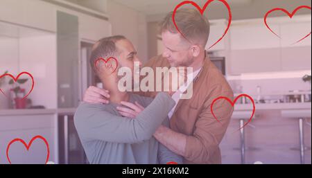 Image of heart icons over diverse gay couple embracing Stock Photo