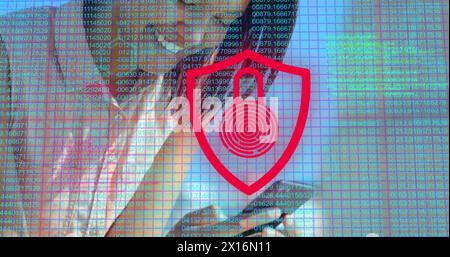 Image of number and digital padlock over hands of asian woman using smartphone Stock Photo