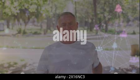 Image of network of connections over senior caucasian man running Stock Photo