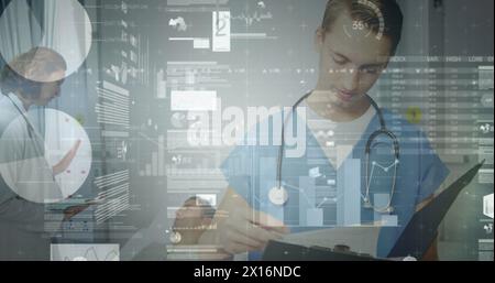 Image of data processing over caucasian male health worker reading reports at hospital Stock Photo