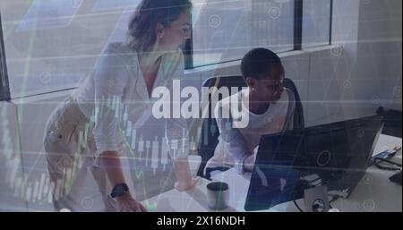 Image of financial data processing over two diverse female colleagues discussing at office Stock Photo