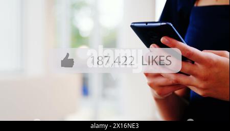 Image of media icon over hands using smartphone Stock Photo