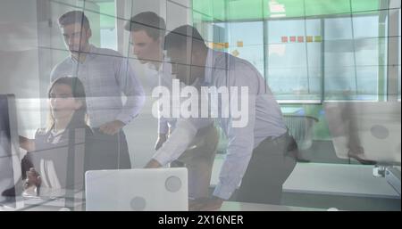 Image of data processing over diverse business people using laptop Stock Photo