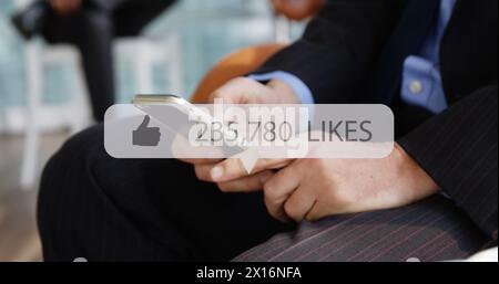 Image of media icon over hands using smartphone Stock Photo