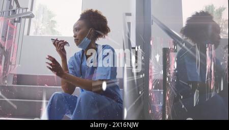 Image of network of connections over african american female doctor Stock Photo