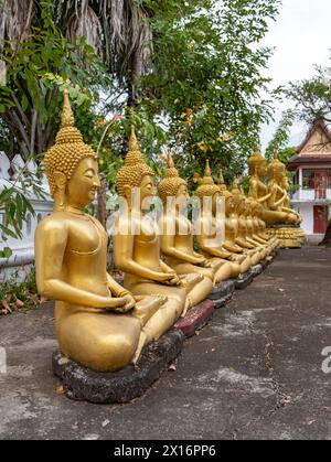 Row of golden Buddha images, Wat That Luang temple, Luang Prabang, Laos Stock Photo