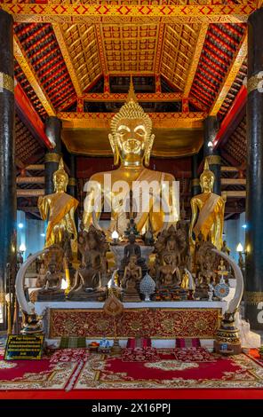 Collection of Buddha images at Wat Wisunarat temple, Luang Prabang, Laos Stock Photo