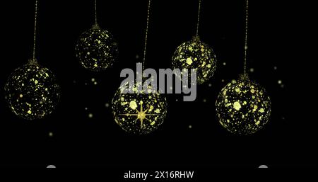 Image of dots over golden baubles on black background Stock Photo