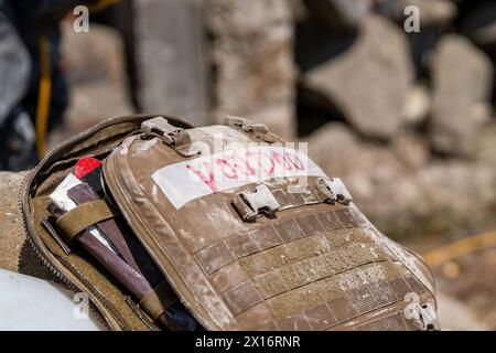 A backpack with the word Voodoo written on it. The backpack is brown and has a red label Stock Photo