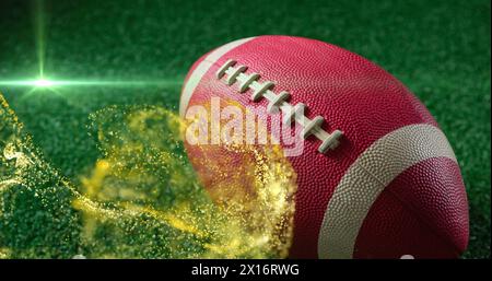 Image of moving lens flare and abstract pattern over rugby ball on green filed Stock Photo