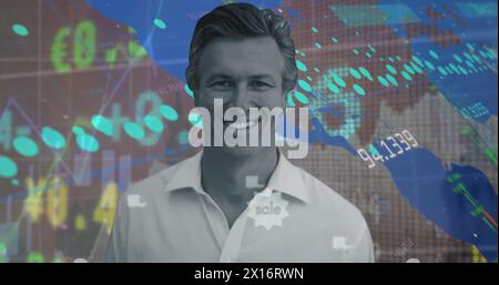 Image of portrait of smiling caucasian man over moving trading board, graph and numbers Stock Photo