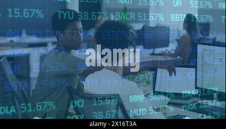 Image of trading board over diverse female coworkers discussing floor plans over desktop Stock Photo