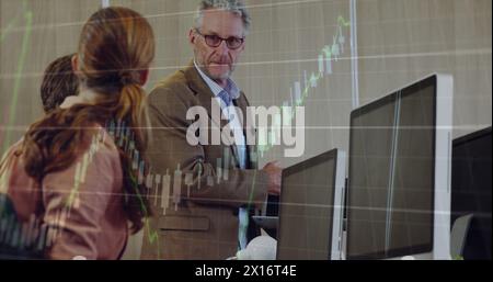 Image of financial data processing over diverse business people at office Stock Photo
