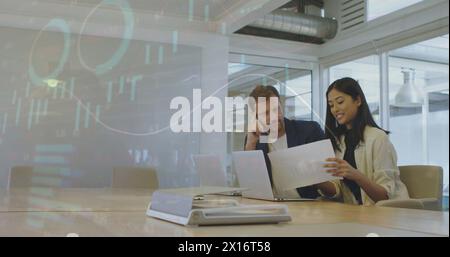 Global business colleagues discussing over document in conference room at office Stock Photo