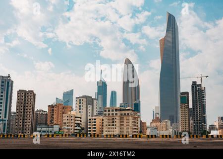 Skyscrapers in the business district of Kuwait City, notably Al Hamra Tower (tallest) and NBK Tower (oval shaped) Stock Photo
