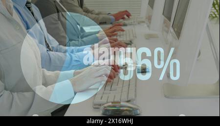 Image of increasing percentage over mid section of businesspeople typing on keyboards at office Stock Photo
