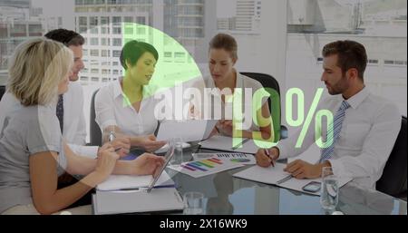 Image of percent, pie chart financial data processing over diverse business people Stock Photo