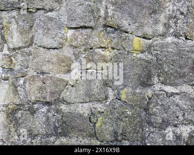 Old stone wall with different size of rocks Stock Photo