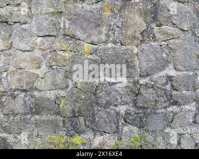 Old stone wall with different size of rocks Stock Photo