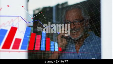 Image of multiple graphs, computer language over senior caucasian man talking on cellphone Stock Photo
