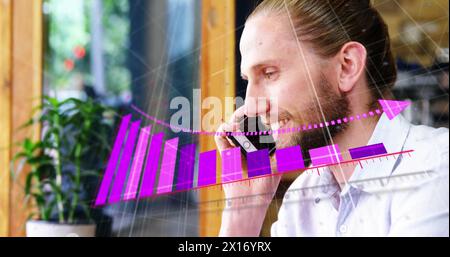 Image of arrow on falling graph over caucasian man talking on smartphone Stock Photo