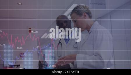 Image of multiple graphs with changing numbers over diverse doctors discussing patient x-ray Stock Photo