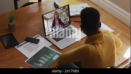 Image of digital interface and 6g text over african american woman using laptop Stock Photo