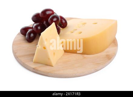 Pieces of delicious cheese and grapes isolated on white Stock Photo