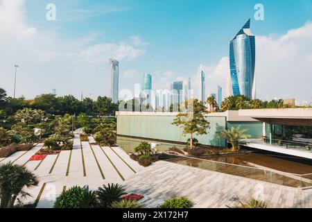 The Al Tijaria Tower looms over Al Shaheed Park in Kuwait City, Kuwait Stock Photo