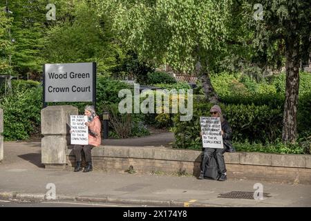 London, Britain, UK. 15th Apr, 2024. Wood Green Crown Court, London, UK, 15 April 2024. Defend Our Juries campaigners at London's Wood Green Crown Court hold quotes from the legal code that point at the 'right to be tried by a jury of one's peers'', 'vital protection against the abuse of power that dates back to the Magna Carta.'' They are supporting one of the first concerned citizens that held such sign out of a court of justice, on 18th of April 2024, Trudi Warner. She is on trial this week. Campaigners declare: 'we are sharing publicly available informations with th Stock Photo